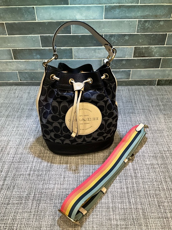 Coach Handbags - Coach Dempsey Navy Signature Bucket Bag with Tan Accents and Rainbow Strap